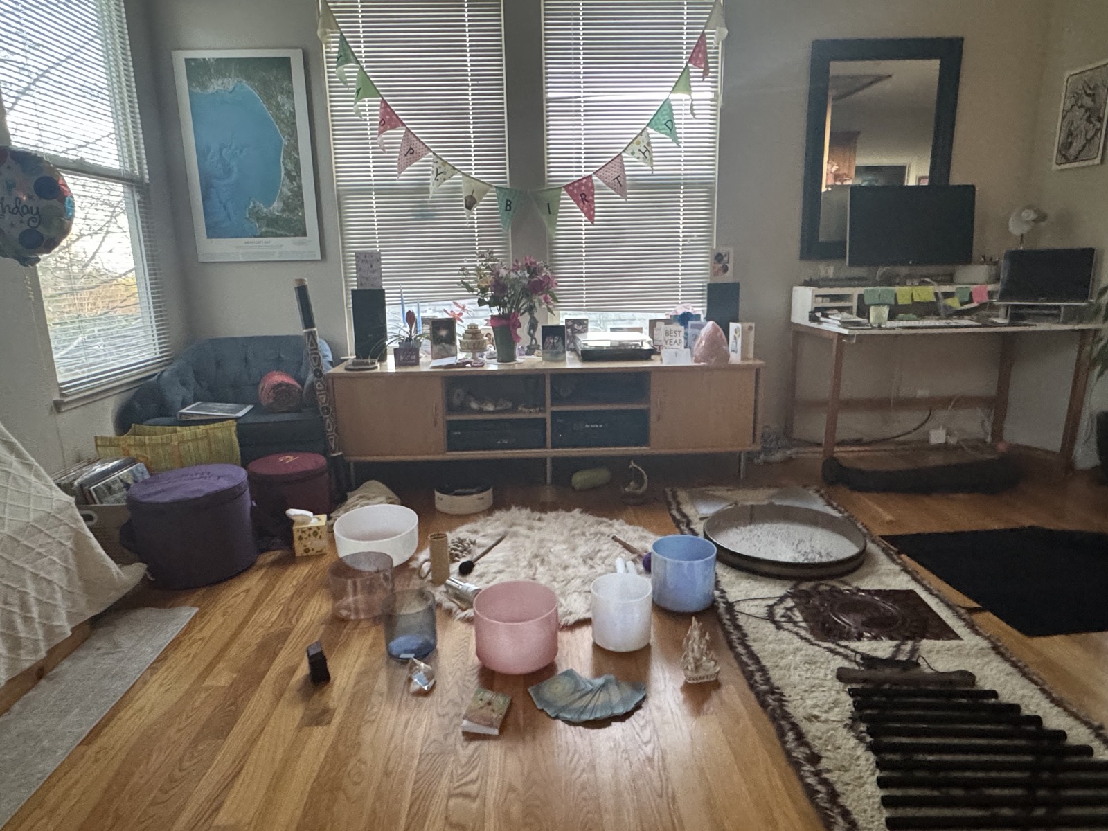Home sound bath setup with crystal bowls and mats
